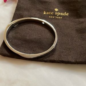 Kate Spade Silver Bangle with signature emblem